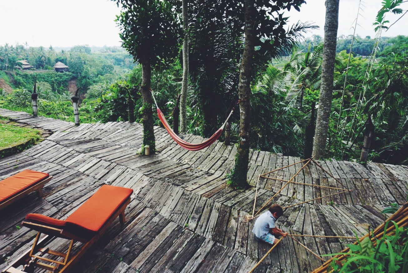 magical boy playing with rubber bands and bamboo